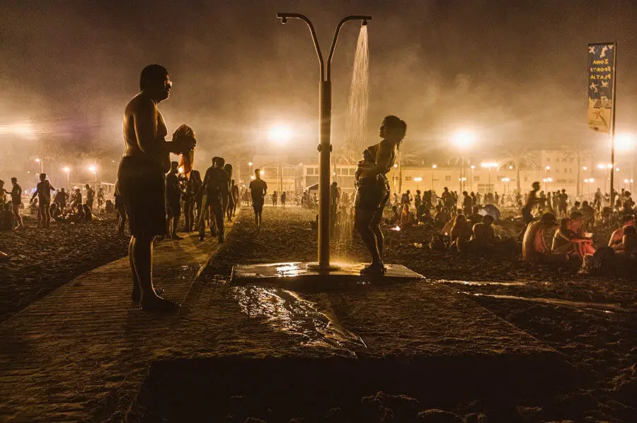 People having a public bath in a street celebration