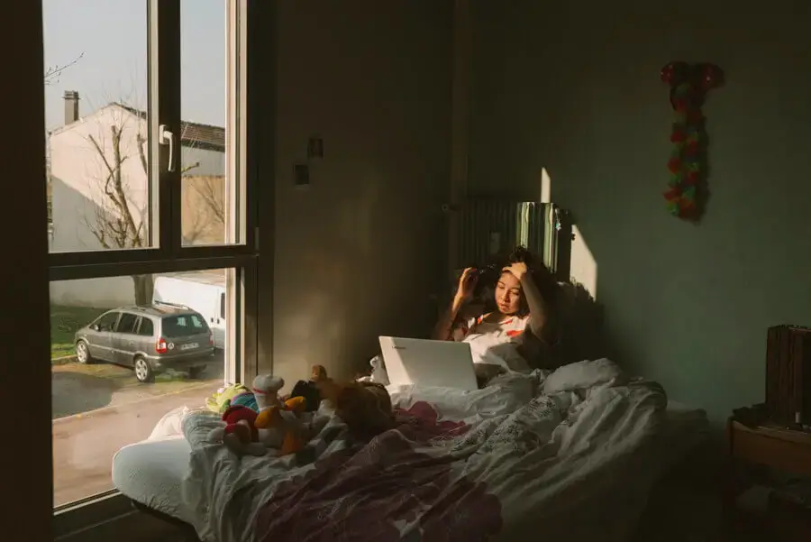 Woman waking up in bed