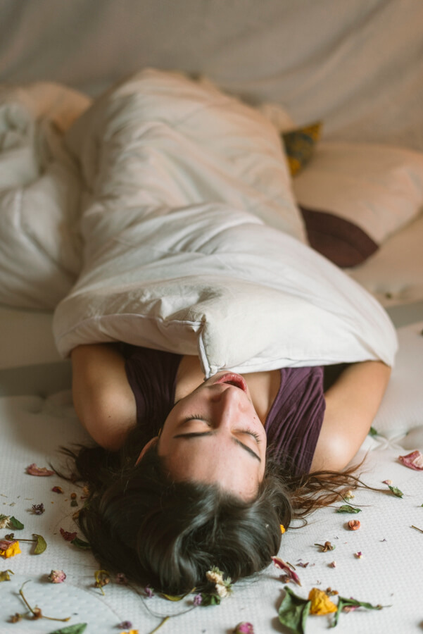 Woman waking up in bed